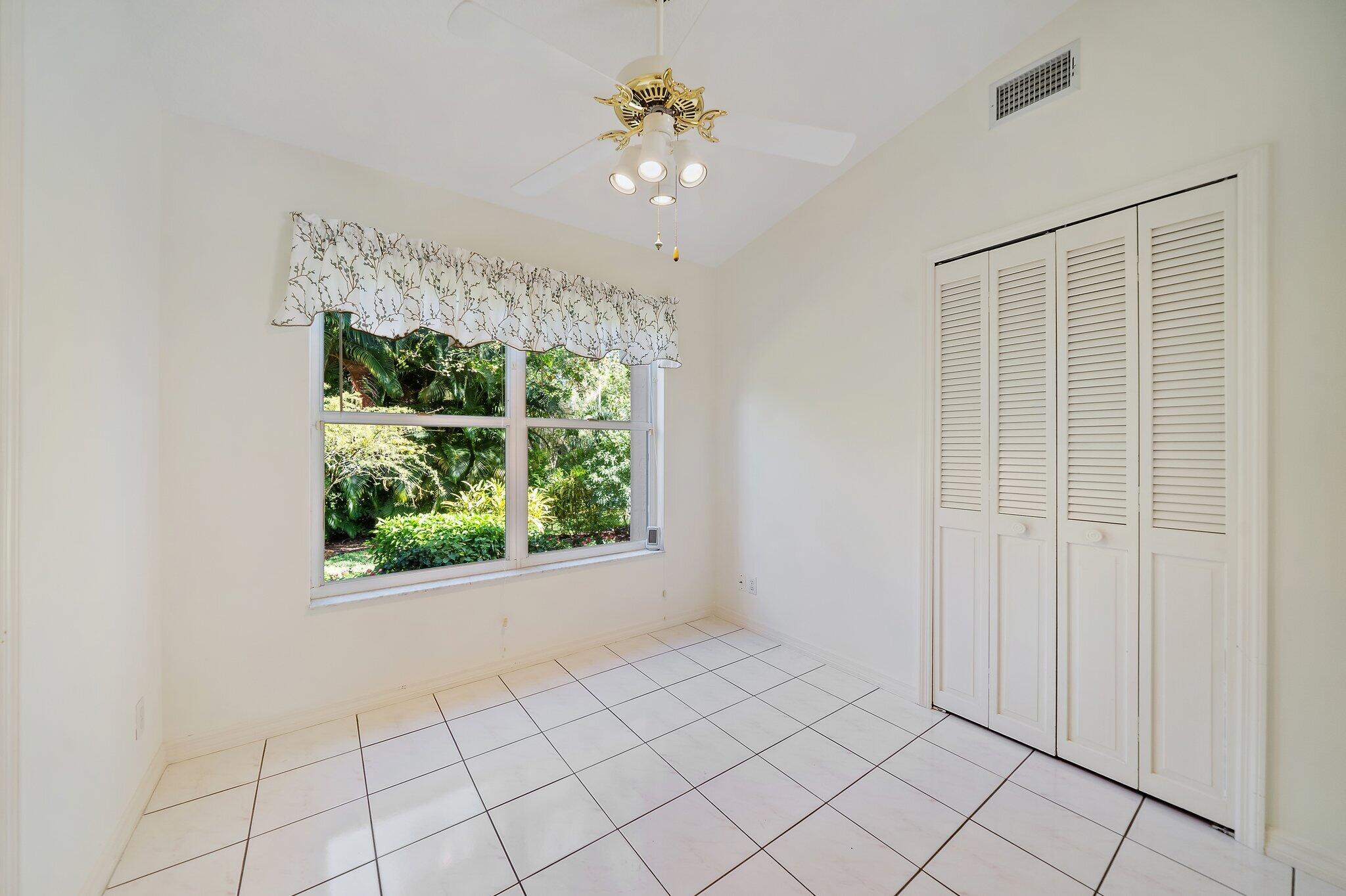 10424 Sandy Run Road Jupiter, FL 33478 - Photo 18 of 52 a view of an empty room with a window