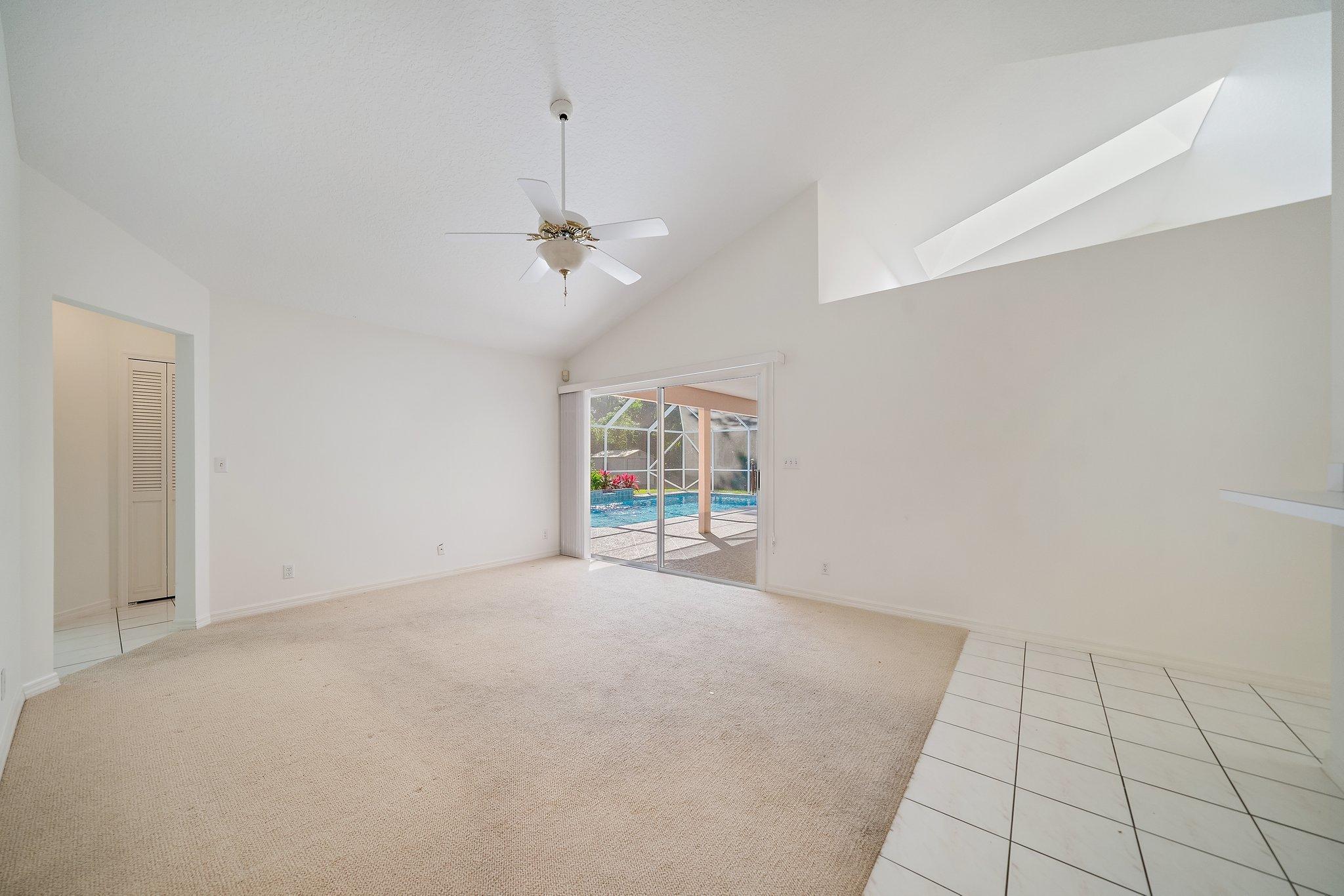 10424 Sandy Run Road Jupiter, FL 33478 - Photo 21 of 52 a view of an empty room with a window
