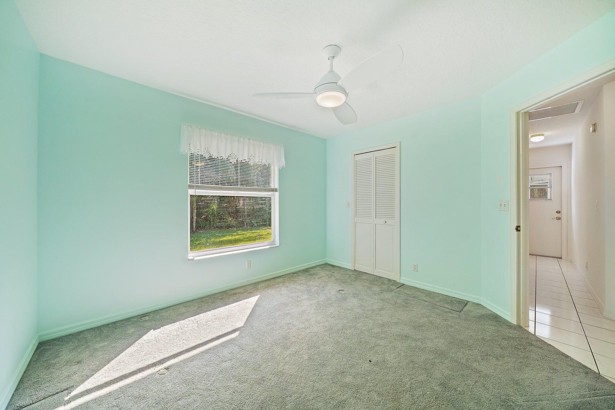 10424 Sandy Run Road Jupiter, FL 33478 - Photo 25 of 52 a view of an empty room with a window