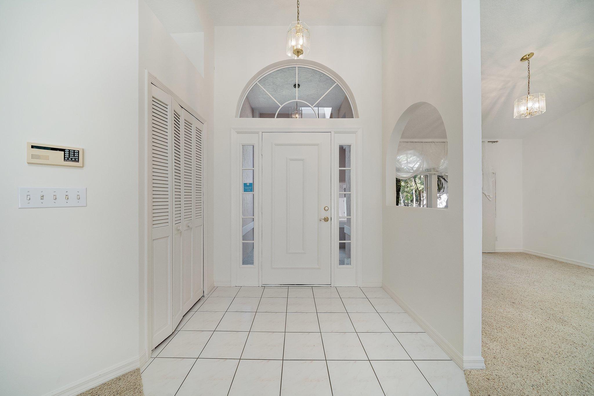 10424 Sandy Run Road Jupiter, FL 33478 - Photo 4 of 52 wooden floor in an empty room
