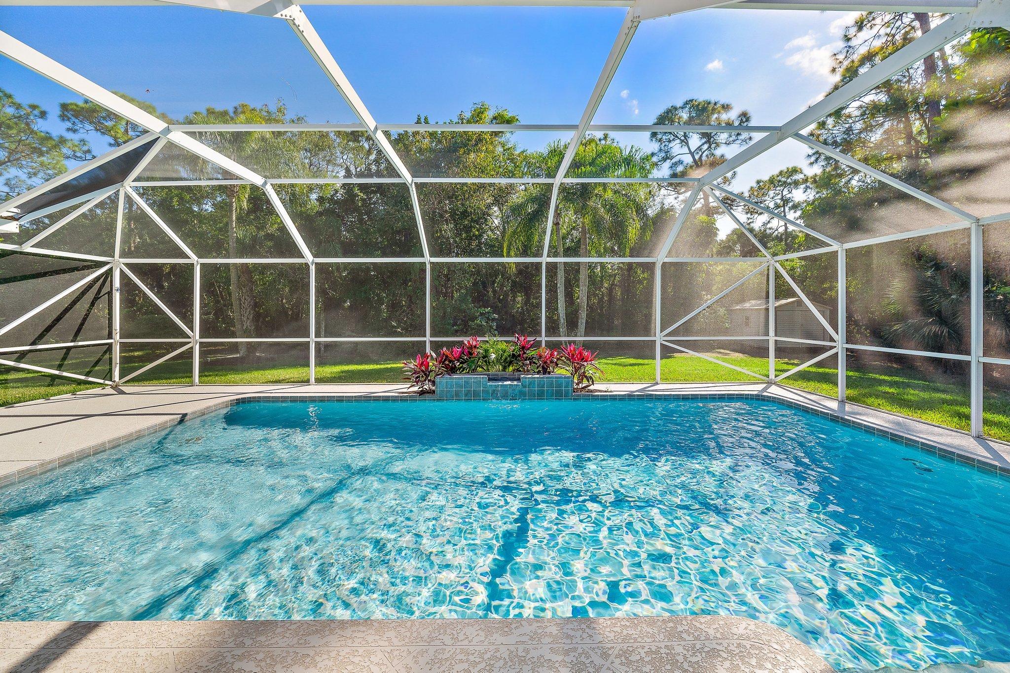 10424 Sandy Run Road Jupiter, FL 33478 - Photo 31 of 52 a view of a backyard with swimming pool of the house