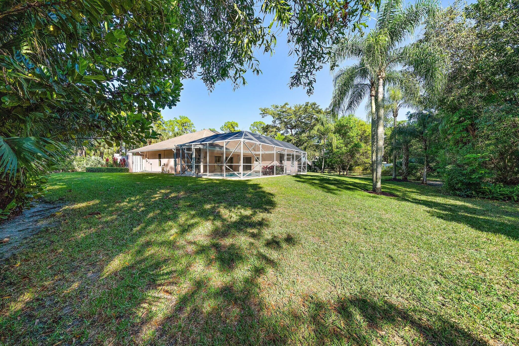 10424 Sandy Run Road Jupiter, FL 33478 - Photo 37 of 52 a view of a house with a yard