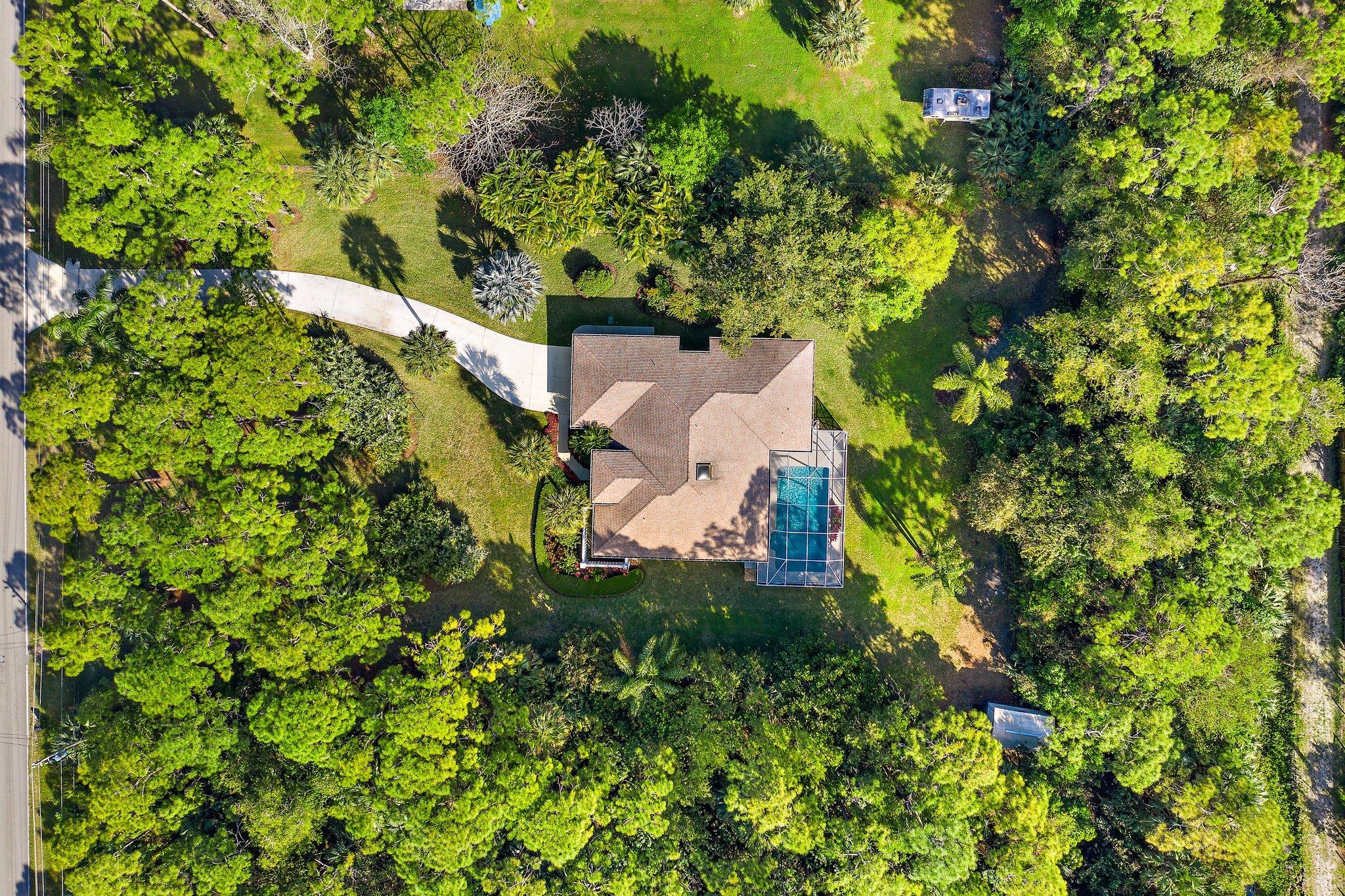 10424 Sandy Run Road Jupiter, FL 33478 - Photo 40 of 52 an aerial view of a house with a yard
