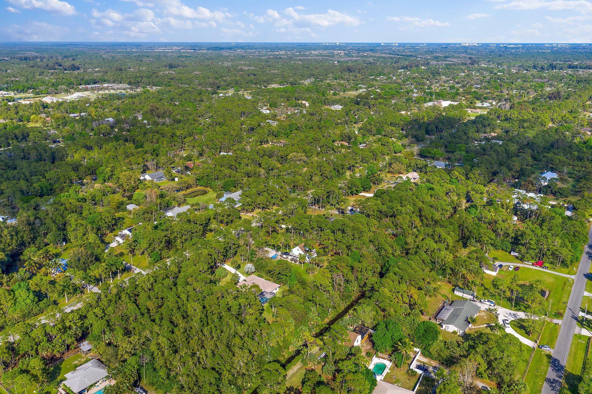 10424 Sandy Run Road Jupiter, FL 33478 - Photo 48 of 52 a view of a lush green field