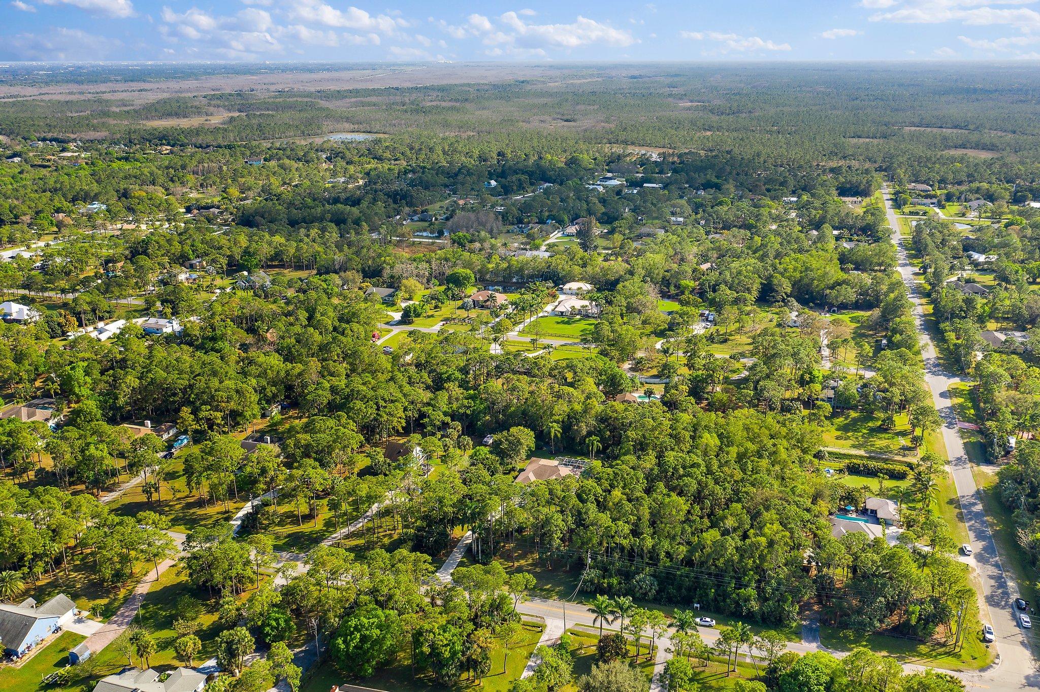 10424 Sandy Run Road Jupiter, FL 33478 - Photo 50 of 52 a view of a city with an ocean