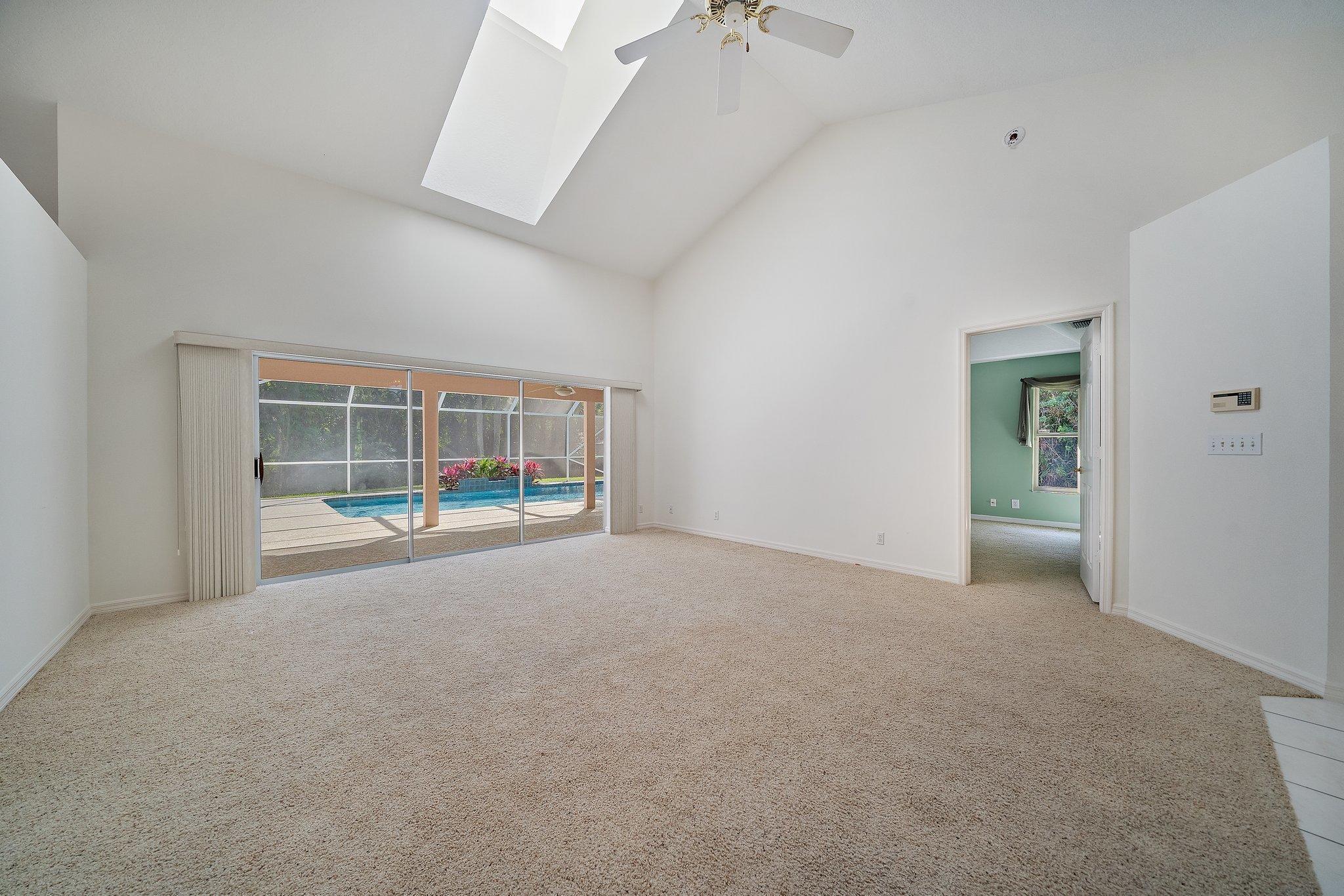 10424 Sandy Run Road Jupiter, FL 33478 - Photo 7 of 52 a view of an empty room with a window