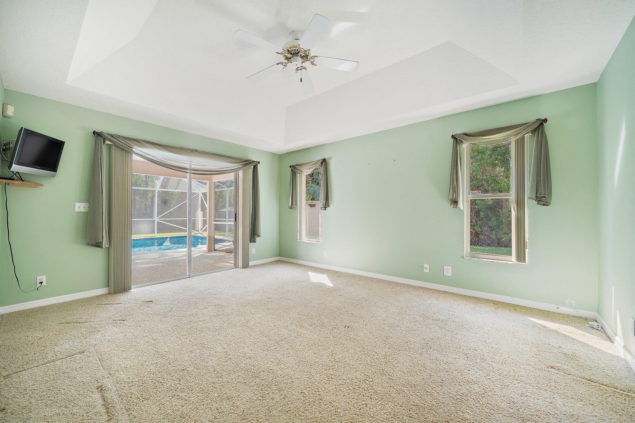 10424 Sandy Run Road Jupiter, FL 33478 - Photo 10 of 52 a view of an empty room with a window
