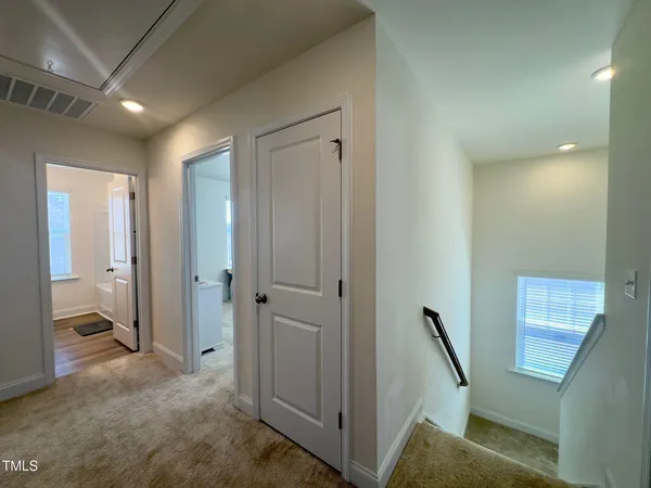a view of a hallway to other room