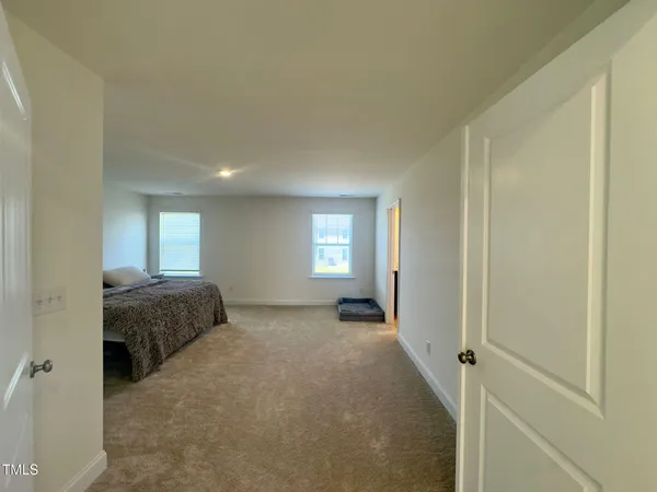 a room with a bed and a window