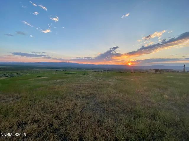 a view of mountain with sunset