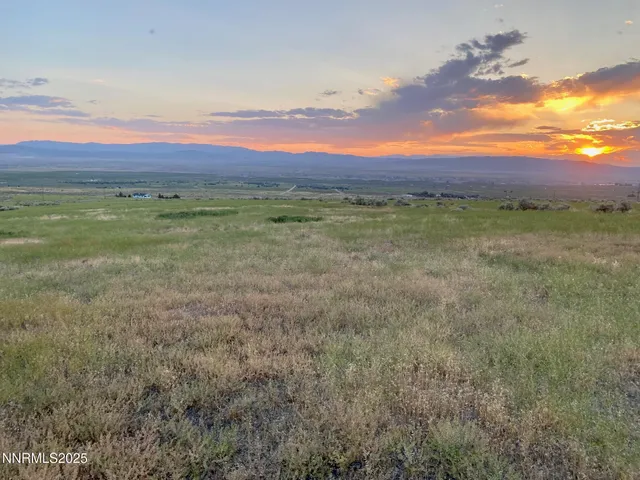 a view of a field with an outdoor space