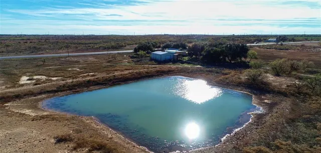 a view of a lake from a yard