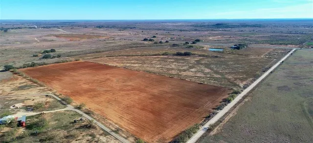 a view of a road with an ocean