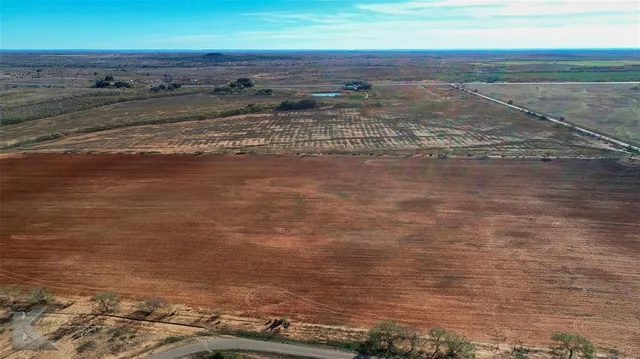 a view of a backyard of the house
