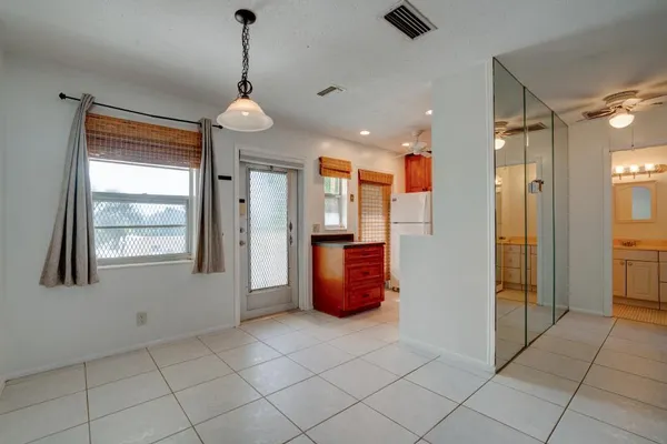 a view of an entryway with wooden floor
