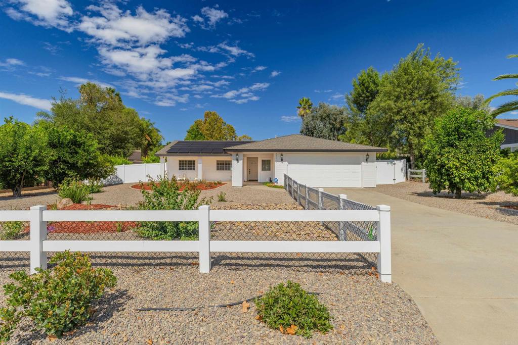 front view of a house with a bench