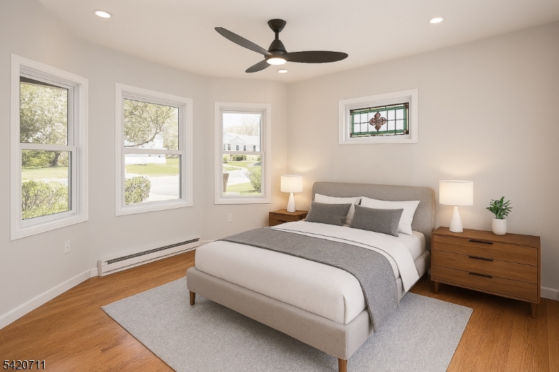 1324 George Street Plainfield, NJ 07062 - Photo 18 of 26 a bedroom with a bed and a window