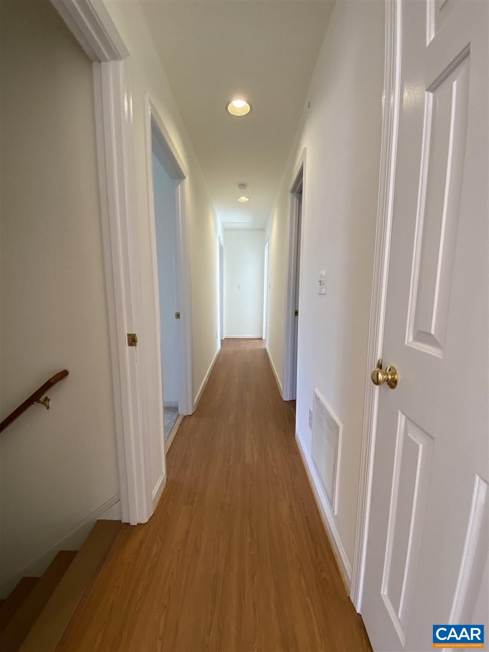 49 Laguna Road Palmyra, VA 22963 - Photo 13 of 27 a view of a hallway with wooden floor