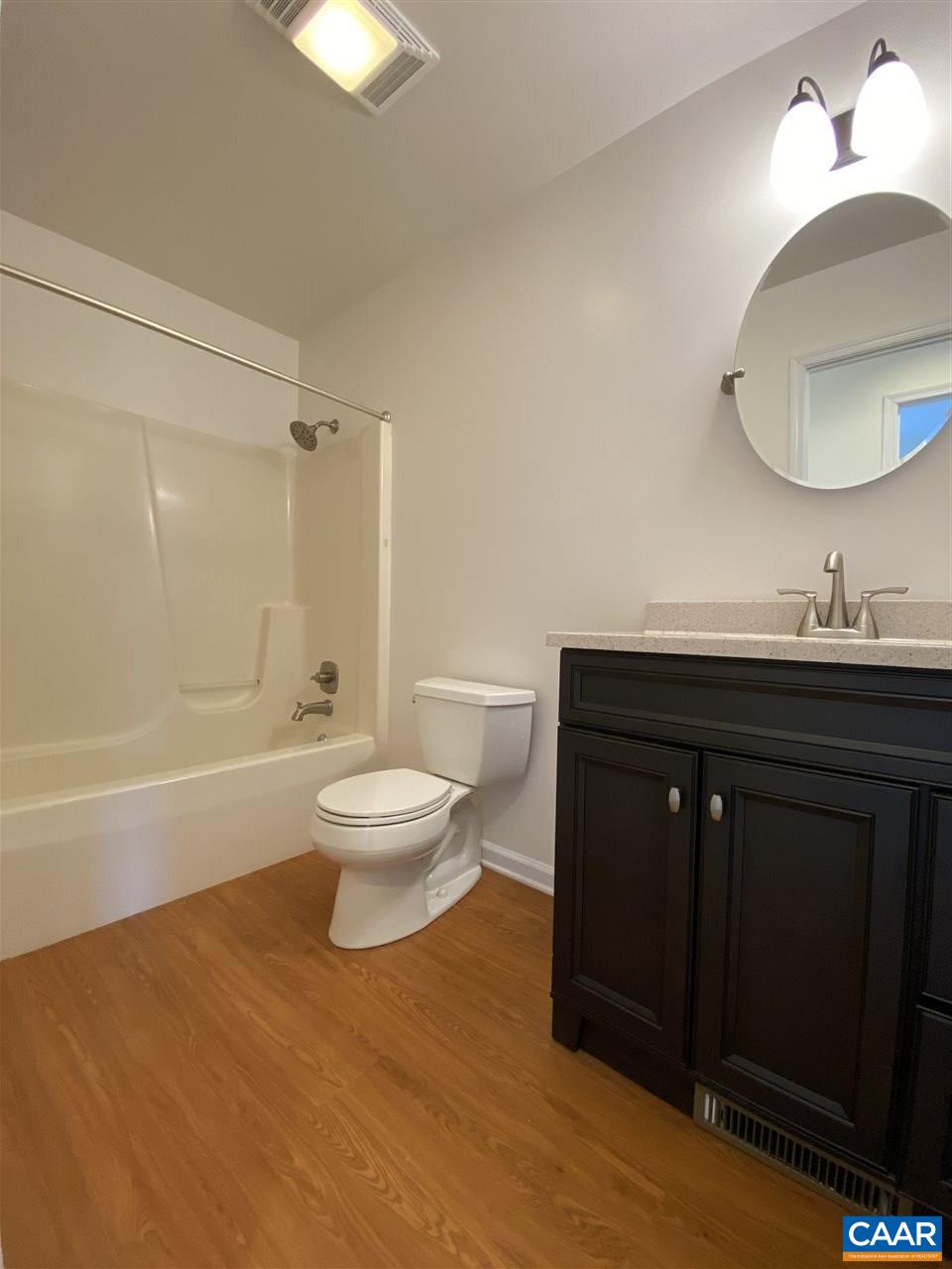 49 Laguna Road Palmyra, VA 22963 - Photo 14 of 27 a bathroom with a sink a toilet and a bathtub