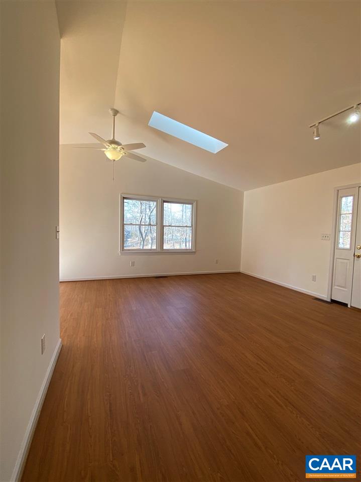 49 Laguna Road Palmyra, VA 22963 - Photo 4 of 27 an empty room with wooden floor and windows