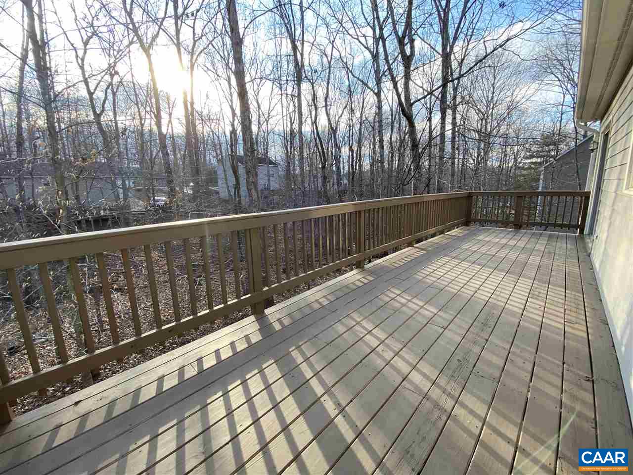 49 Laguna Road Palmyra, VA 22963 - Photo 7 of 27 a view of balcony with wooden floor and fence
