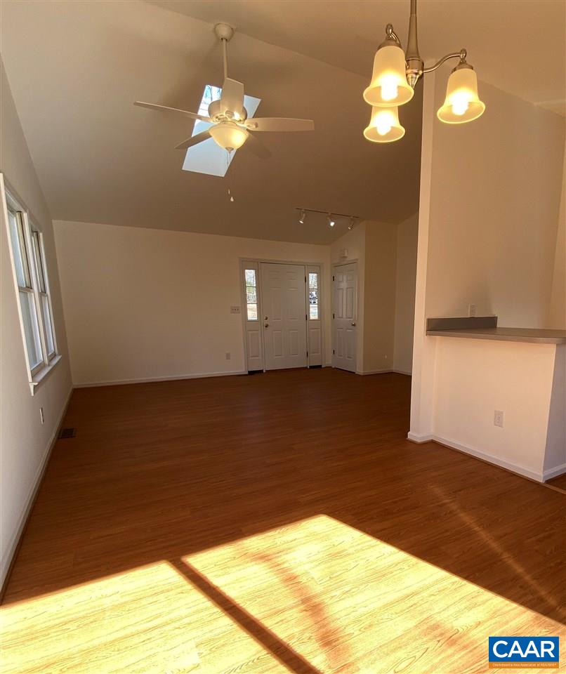 49 Laguna Road Palmyra, VA 22963 - Photo 8 of 27 a view of a room with a chandelier fan and wooden floor