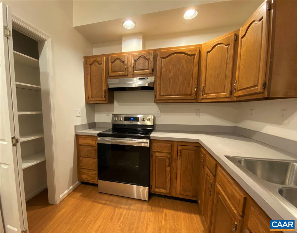 49 Laguna Road Palmyra, VA 22963 - Photo 10 of 27 a kitchen with stainless steel appliances granite countertop a stove a sink and a microwave