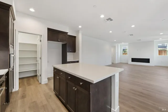 a kitchen with a refrigerator and a sink