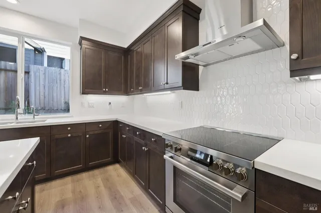 a kitchen with a stove and a sink