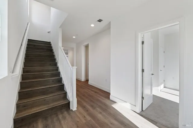 a view of entryway with wooden floor