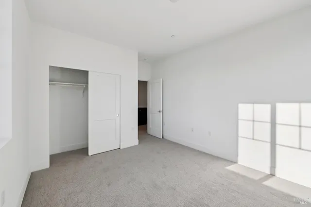 a bathroom with a granite countertop sink a toilet and a tub