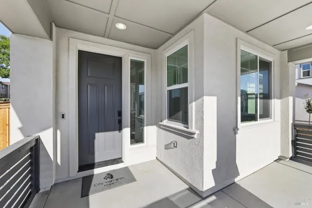 a view of kitchen with furniture and large window