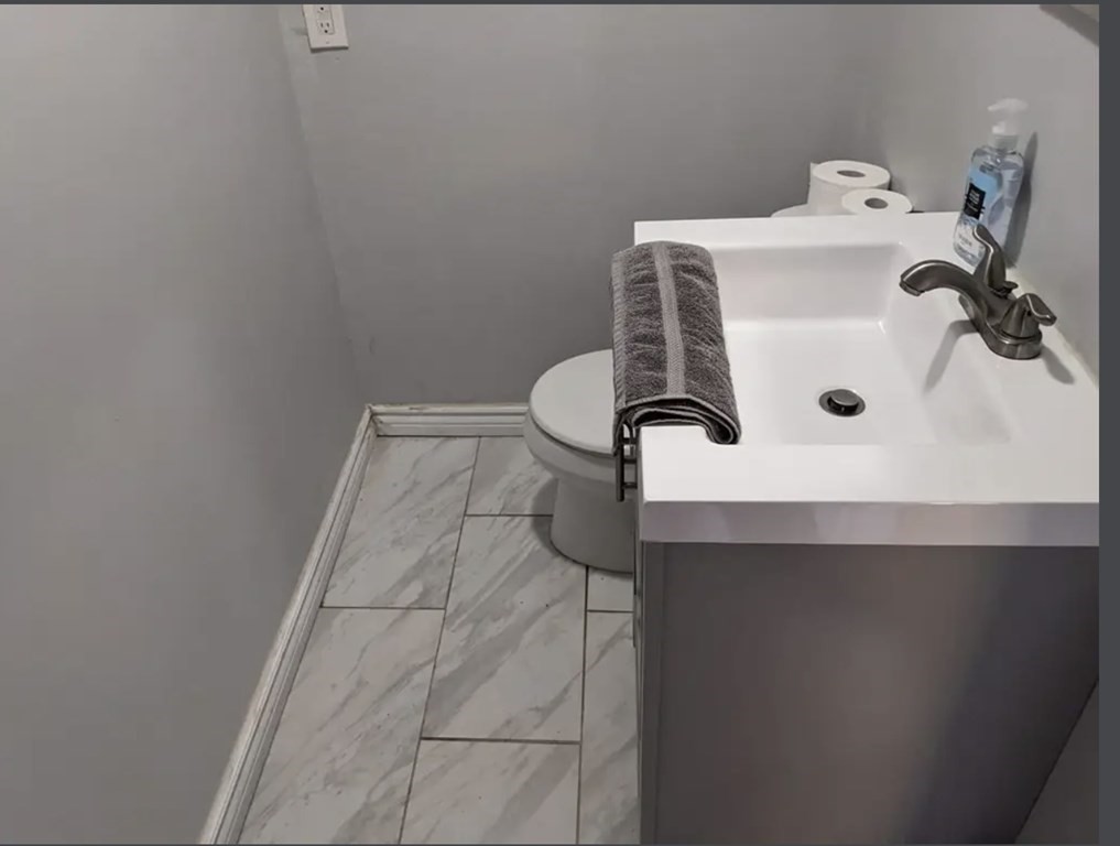 147 Forest Street Middleton, MA 01949 - Photo 11 of 32 a bathroom with a sink and mirror