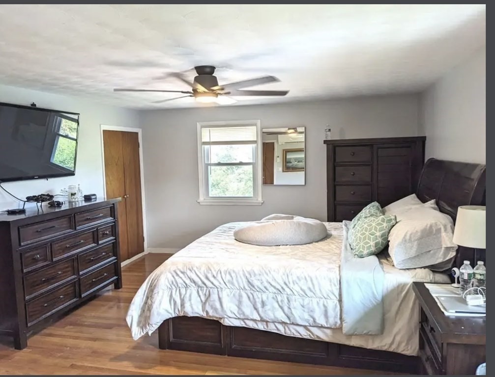 147 Forest Street Middleton, MA 01949 - Photo 12 of 32 a bedroom with a bed and window