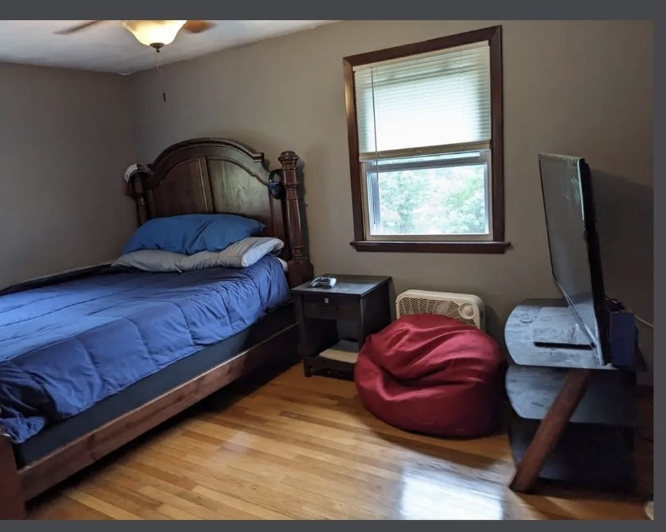 147 Forest Street Middleton, MA 01949 - Photo 14 of 32 a bedroom with a bed window and dresser
