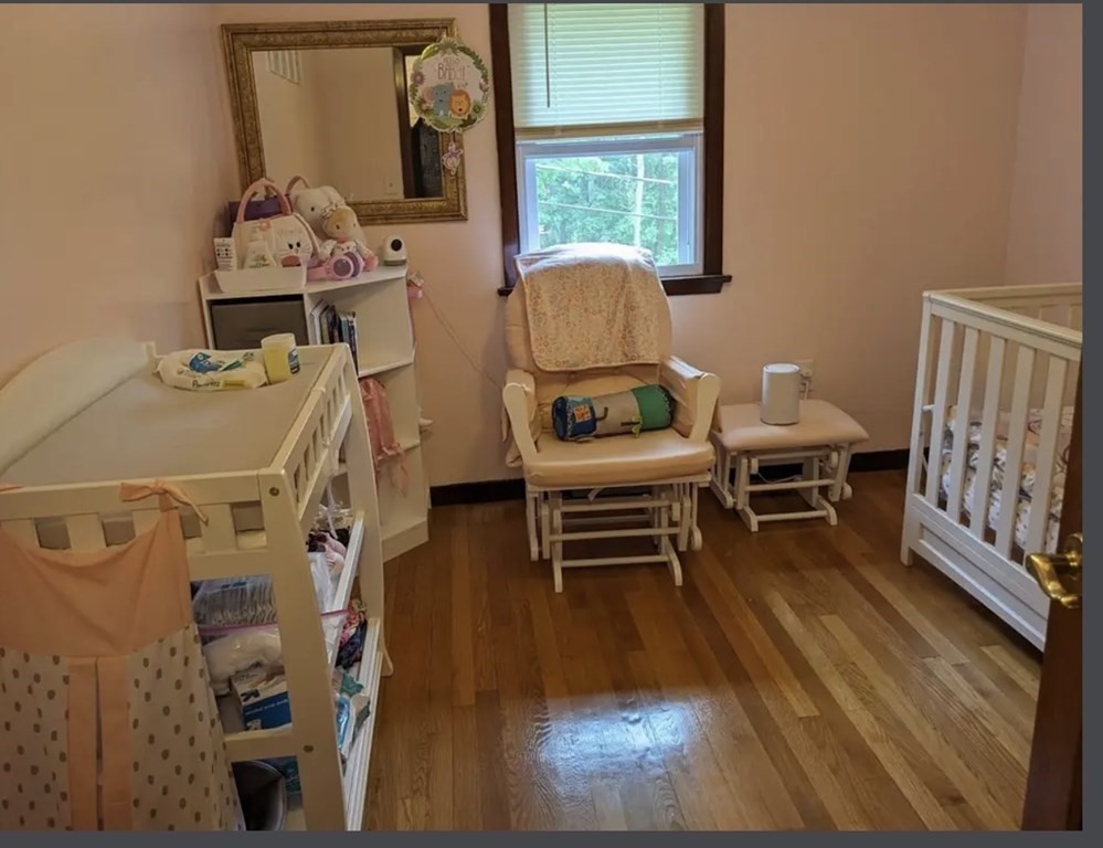 147 Forest Street Middleton, MA 01949 - Photo 15 of 32 a living room with furniture and a wooden floor