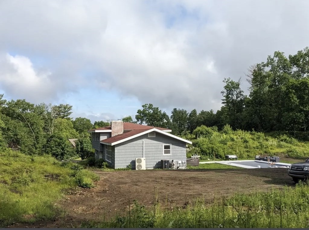 147 Forest Street Middleton, MA 01949 - Photo 19 of 32 a view of a house with a big yard plants and large trees