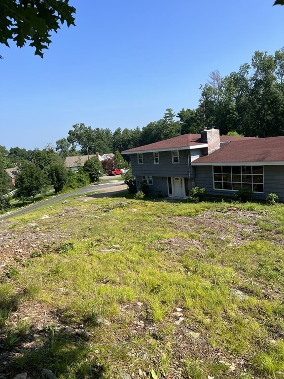 147 Forest Street Middleton, MA 01949 - Photo 20 of 32 a view of a house with a yard
