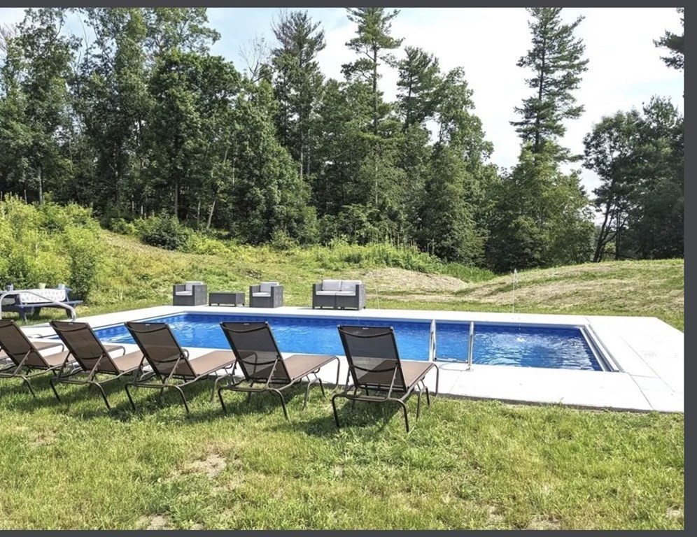 147 Forest Street Middleton, MA 01949 - Photo 2 of 32 a view of a yard with furniture