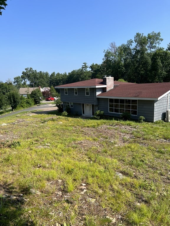 147 Forest Street Middleton, MA 01949 - Photo 21 of 32 a view of a house with a yard