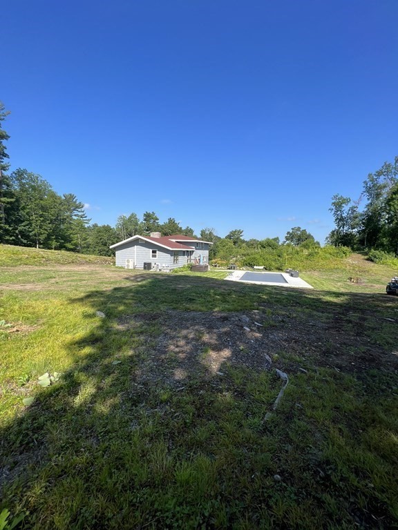 147 Forest Street Middleton, MA 01949 - Photo 23 of 32 a view of a town with an ocean and trees