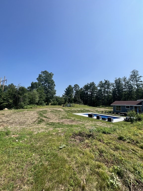 147 Forest Street Middleton, MA 01949 - Photo 25 of 32 a view of a swimming pool with a yard