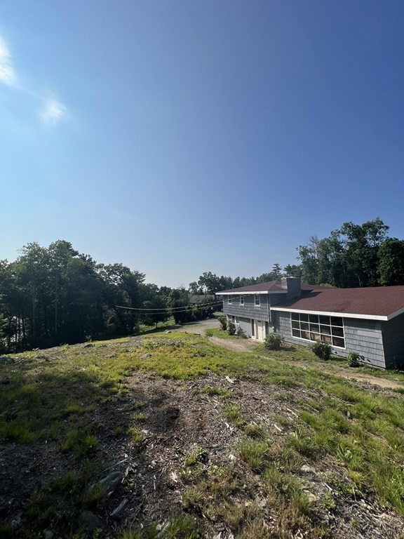 147 Forest Street Middleton, MA 01949 - Photo 27 of 32 a view of house with outdoor space and swimming pool