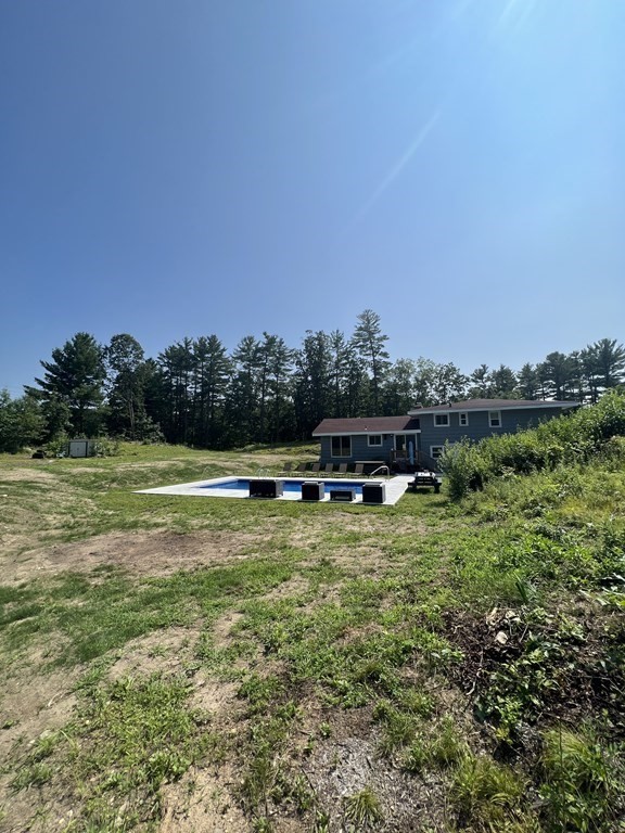 147 Forest Street Middleton, MA 01949 - Photo 28 of 32 a swimming pool with trees in the background