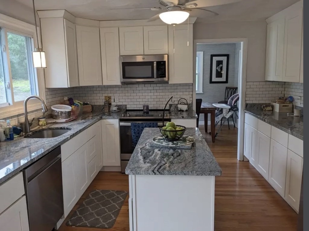 147 Forest Street Middleton, MA 01949 - Photo 4 of 32 a kitchen with a sink stove top oven and microwave