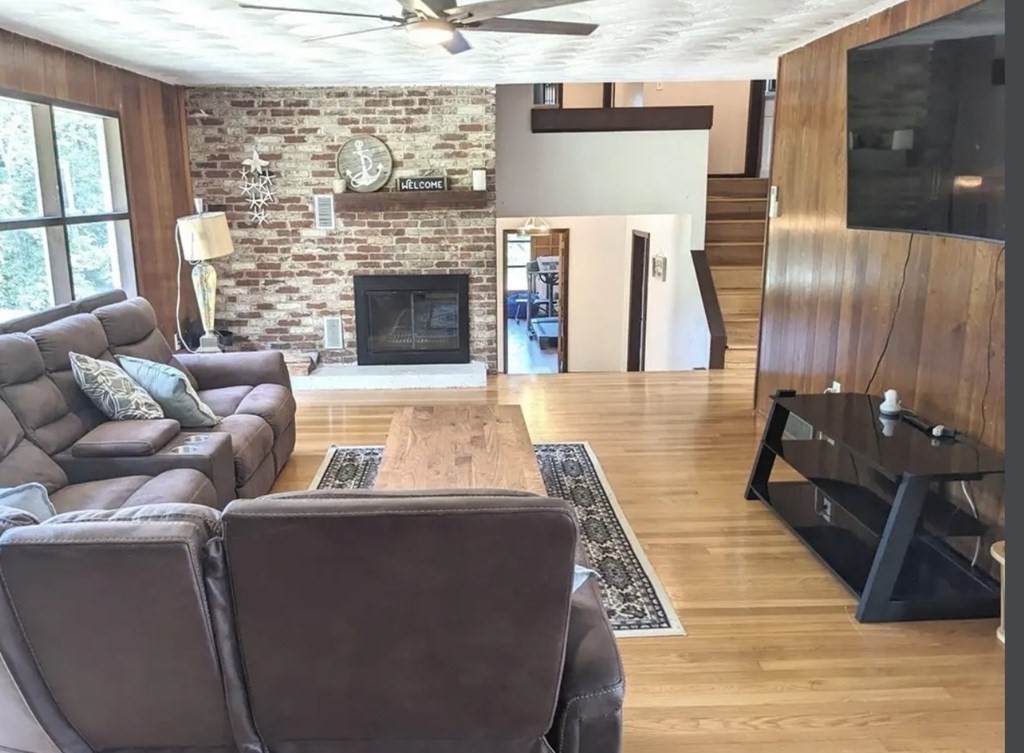 147 Forest Street Middleton, MA 01949 - Photo 6 of 32 a living room with furniture and a fireplace