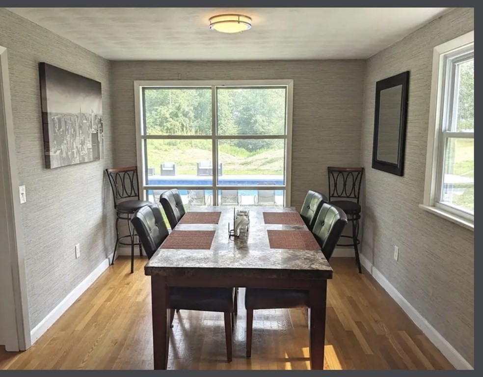 147 Forest Street Middleton, MA 01949 - Photo 8 of 32 a view of a dining room with furniture window and wooden floor