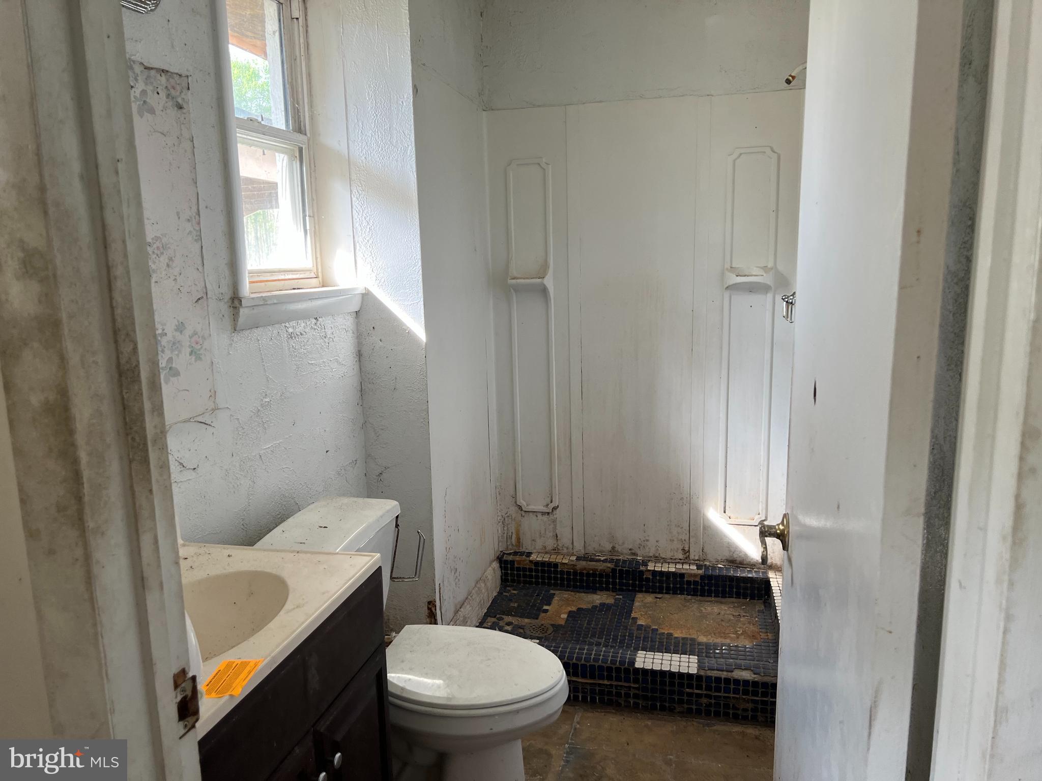 6705 Bumpy Oak Road La Plata, MD 20646 - Photo 13 of 36 a bathroom with a granite countertop toilet and a sink