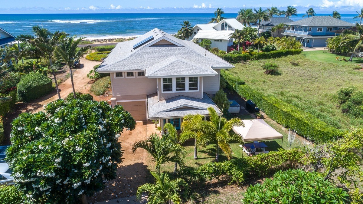 8224 A Elepaio Road Kekaha, HI 96752 - Photo 1 of 24 an aerial view of a house with a garden