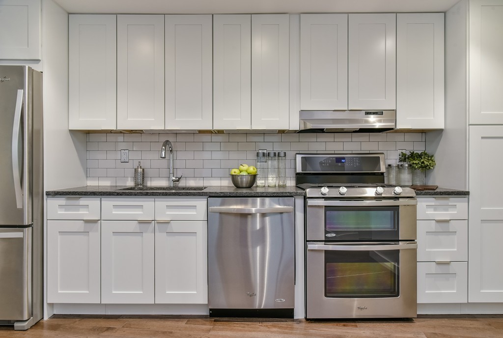126 Salem Street, Unit 3 Boston, MA 02113 - Photo 2 of 14 a kitchen with stainless steel appliances granite countertop a stove a sink and a microwave